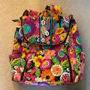 Medium sized backpack from Vera Bradley. Multiple colors with a flower pattern.